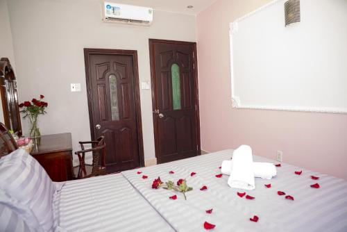 Кровать или кровати в номере Love Phu Quoc