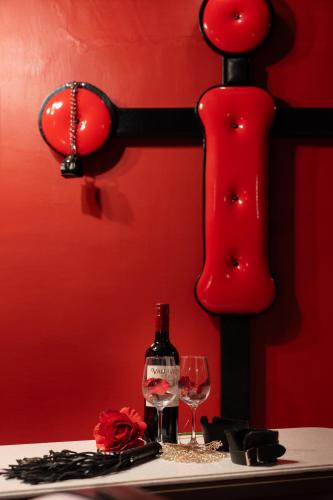 a bottle of wine and two glasses on a table at M'SCLUB OsakaHirano AdultOnly in Osaka