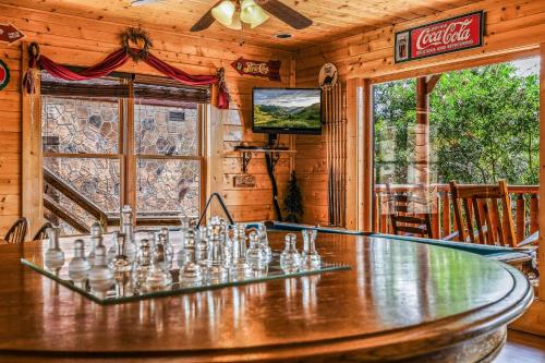 a dining room with a table in a cabin at Extravagant View Cabin in Park Settlement