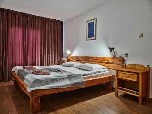 Ένα ή περισσότερα κρεβάτια σε δωμάτιο στο Hotel Tihiat Kat