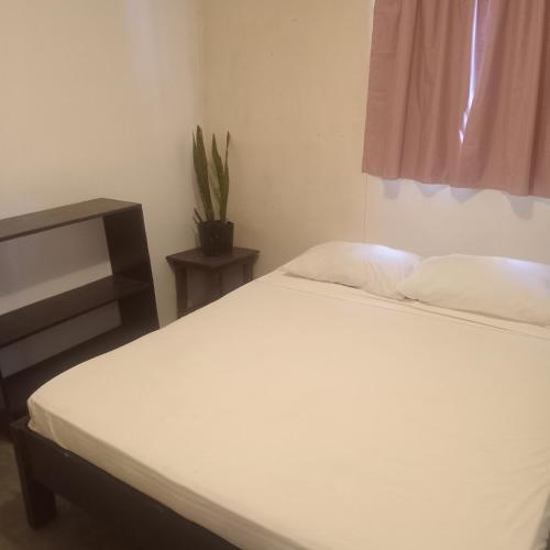 Ліжко або ліжка в номері Iso homestay