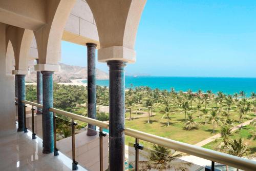 a view of the ocean from the balcony of a resort at Al Bustan Palace, a Ritz-Carlton Hotel in Muscat