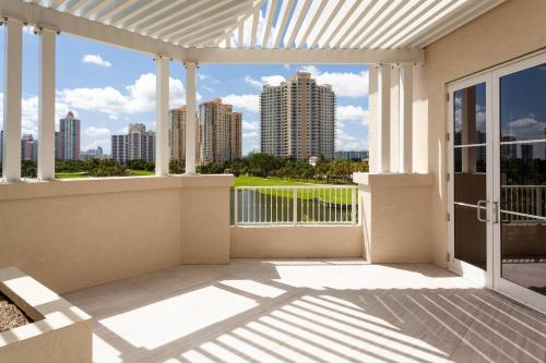 a balcony with a view of the city at JW Marriott Miami Turnberry Resort & Spa in Aventura