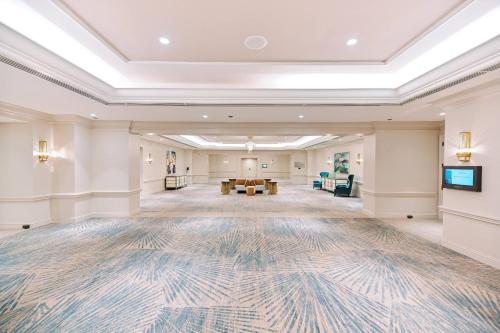 a large lobby with a large rug on the floor at JW Marriott Miami Turnberry Resort & Spa in Aventura
