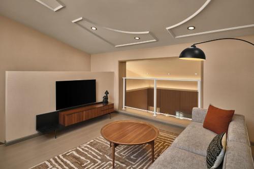 TV a/nebo společenská místnost v ubytování Sheraton Samoa Aggie Grey's Hotel & Bungalows