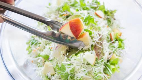 a salad with a fork in a glass bowl at Toyoko Inn Fukushima-eki Higashi-guchi No 2 in Fukushima