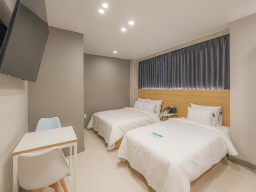 Voodi või voodid majutusasutuse Hotel Leo Changwon Central Branch toas