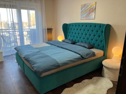 Postel nebo postele na pokoji v ubytování Esterhazy Apartman