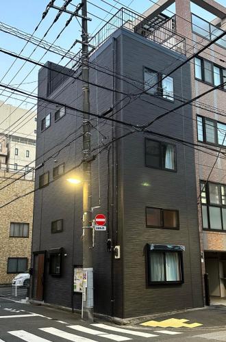 a building with a street light in front of it at VanillaHotel-Fukagawa in Tokyo