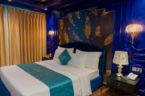 Cama o camas de una habitación en Lotus Aroma Hotel