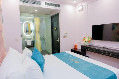Cama o camas de una habitación en Lotus Aroma Hotel