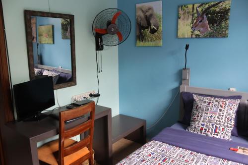 Postel nebo postele na pokoji v ubytování Umusambi B&B