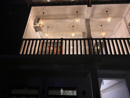 a staircase in a house with lights on the ceiling at Birds Nest 2 in Bandaramulla