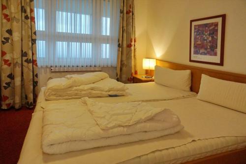 Postel nebo postele na pokoji v ubytování Ferienwohnung De Draggen