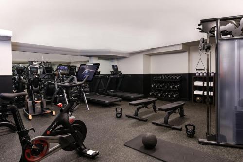 a gym with treadmills and exercise equipment in a room at HOLLYWOOD VOLUME, a Tribute Portfolio Hotel in Los Angeles