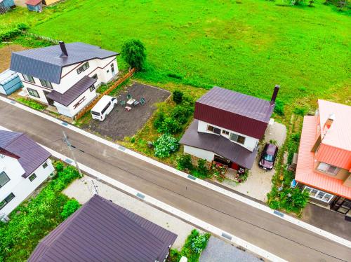 an aerial view of a house and a street at A-JA in Niki