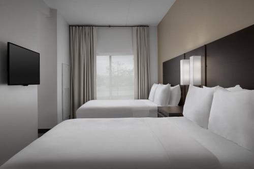 Ένα ή περισσότερα κρεβάτια σε δωμάτιο στο Residence Inn by Marriott Kenwood Cincinnati