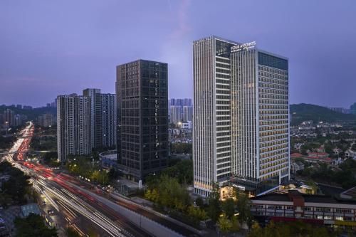 a city with tall skyscrapers and a highway at Four Points by Sheraton Chongqing North Railway Station in Chongqing