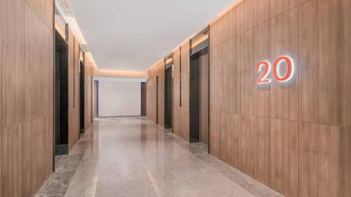 a hallway with a sign on a wall at Holiday Inn Express Foshan Shunde Lecong by IHG in Shunde