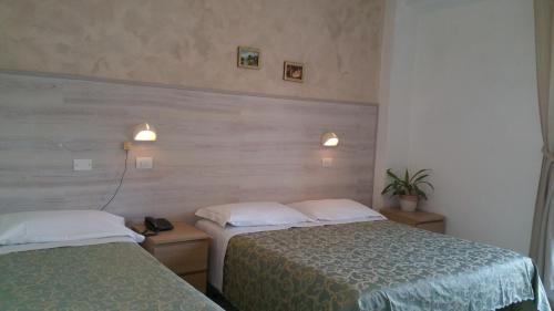 Postel nebo postele na pokoji v ubytování Hotel Canasta