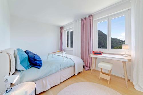 Postel nebo postele na pokoji v ubytování Bella Vista - Unique Experience on Lake Lugano!