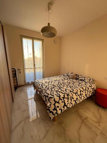 a bedroom with a bed with a teddy bear on it at dalla nonna Paola in Robbiate
