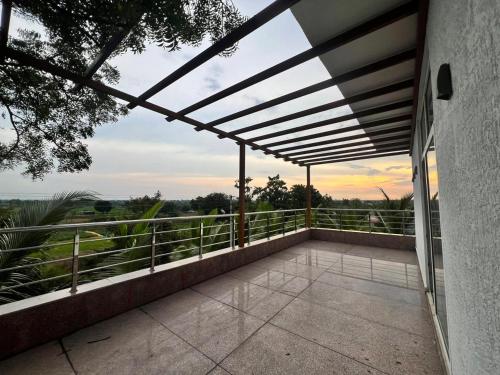 a view from the balcony of a house at Serene farms by guildstone stays in Venkatāpur