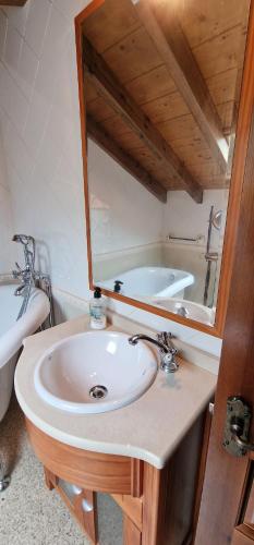 a bathroom with a sink and a bath tub at Redes - El Descanso - AR-484-AS in Caso