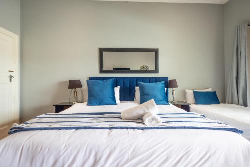 Ένα ή περισσότερα κρεβάτια σε δωμάτιο στο Fusion House B&B and Conference Venue