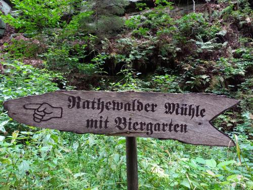 a sign that readsinatorsimateimatemtrigeridateitschinationitschinatorimatenut at Rathewalder Mühle in Rathewalde