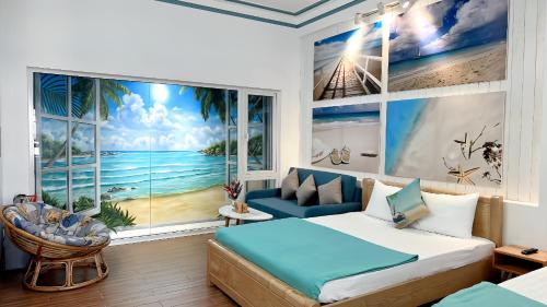 a bedroom with a bed and a view of the ocean at Blossom Sea Homestay Quy Nhơn in Quy Nhon