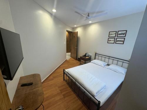 Ένα ή περισσότερα κρεβάτια σε δωμάτιο στο HOTEL ABODE