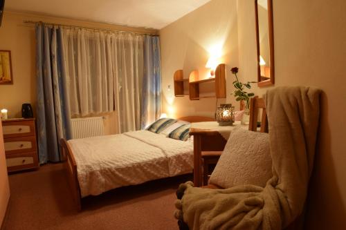 Ένα ή περισσότερα κρεβάτια σε δωμάτιο στο Willa Magnolia