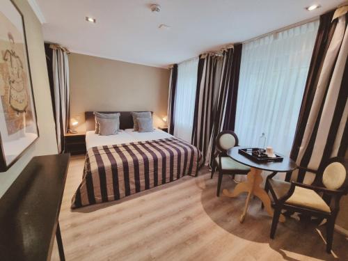 Postel nebo postele na pokoji v ubytování Saillant Hotel Gulpenerland - Auping Hotel Partner