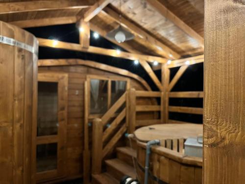 an inside view of a wooden room with a table at Lu Biulè di Pau in Groscavallo