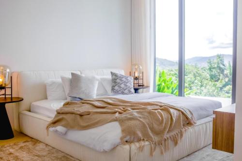 Postel nebo postele na pokoji v ubytování AKRA Collection Layan - Hideaway Villas