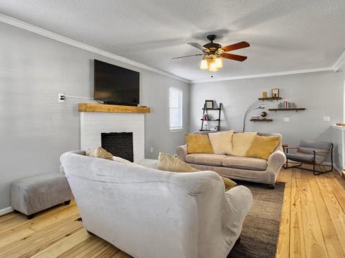 a living room with two couches and a fireplace at Cozy Home Away From Home - Pet-friendly, King bed in Charleston