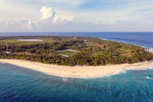 an aerial view of an island in the ocean at Millennium in Fuvahmulah