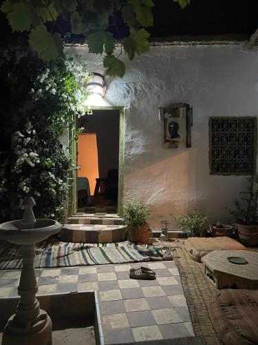 a living room with a tile floor and aoyer with at Maison Berber Ouirgane in Ouirgane