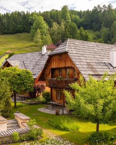 a log cabin in the middle of a forest at st martin chalets in Sankt Michael im Lungau