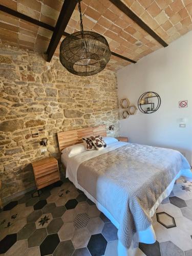 Una cama o camas en una habitación de Borgo del Marchese