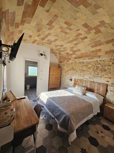 Una cama o camas en una habitación de Borgo del Marchese