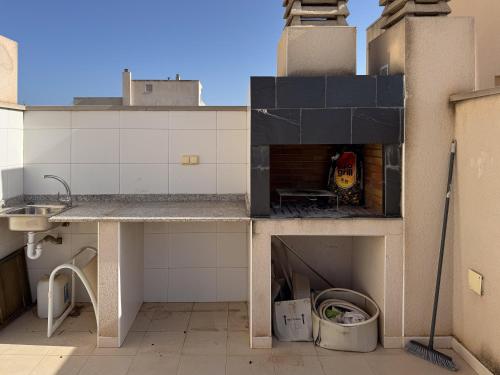 a kitchen with a sink and a counter top at Aire de Levante in Alicante