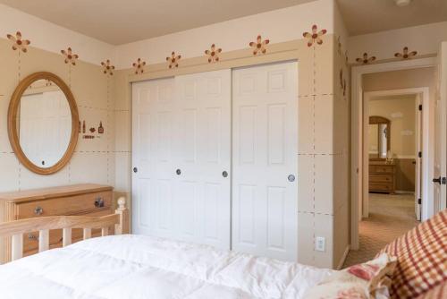 a bedroom with a large white closet and a bed at Elegant beautiful home With Pool & Heated Spa in Las Vegas