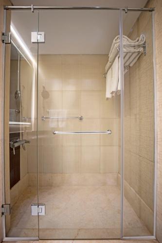 a shower with a glass door in a bathroom at Beau Site Belle Vue Hotel in Marsa Matruh