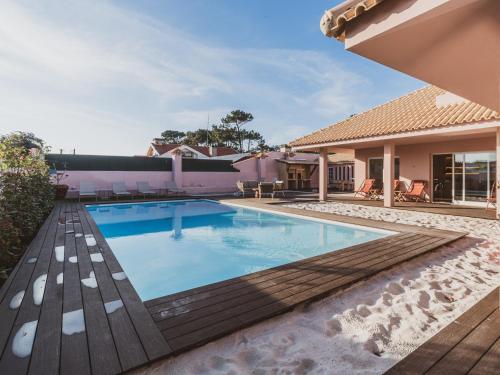 a swimming pool in the backyard of a house at BeSunny Slowness n' Outdoors in Esmoriz
