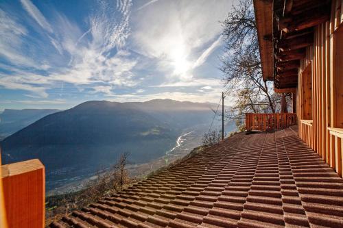 a view from the side of a building looking at a mountain at Hauserhof in Lagundo