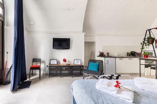 TV a/nebo společenská místnost v ubytování Casa dei Nonni Loft