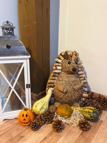 a statue of a bear surrounded by fruits and vegetables at HARMONY Apartments in Rajecké Teplice