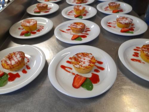 a group of plates of food on a table at Hotel Sporting in Casarsa della Delizia